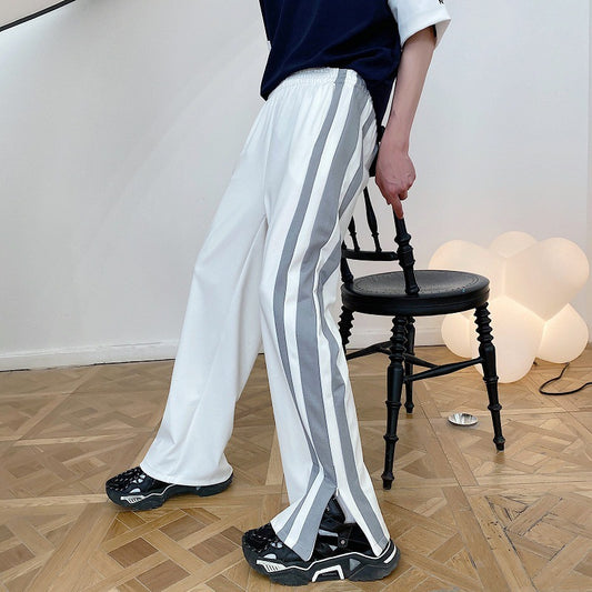 Contrasting side zip slit pants